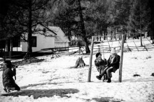 Old and young ladies in the winter forest